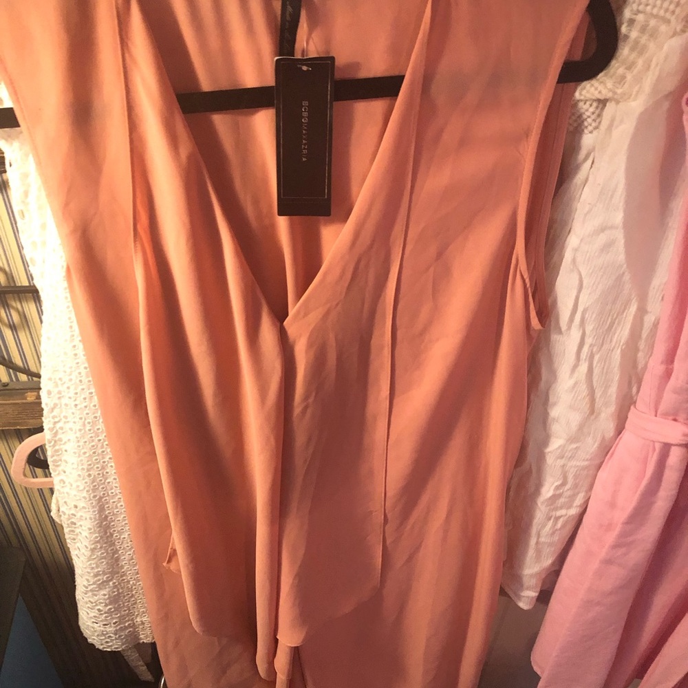 A symmetrical- high/low gorgeous dress. New with tags.